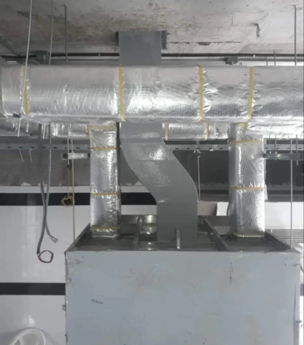 Duct distribution above AC unit