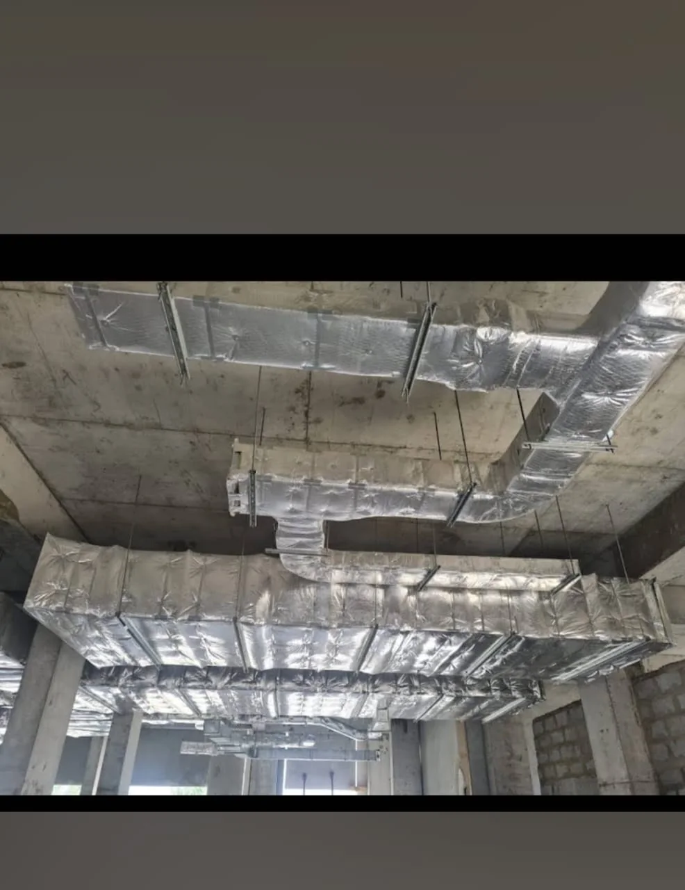Suspended insulated ductwork